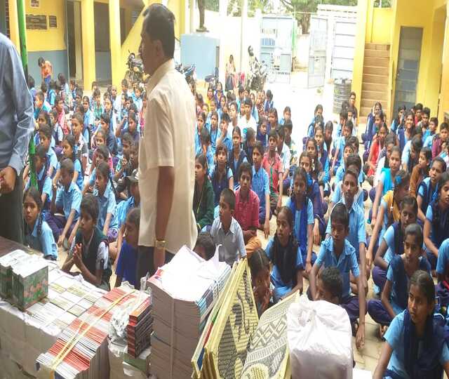 Distribution of 100 Exam Pads and 200 Pen Set at Jayabharathi high School, Attibele cover