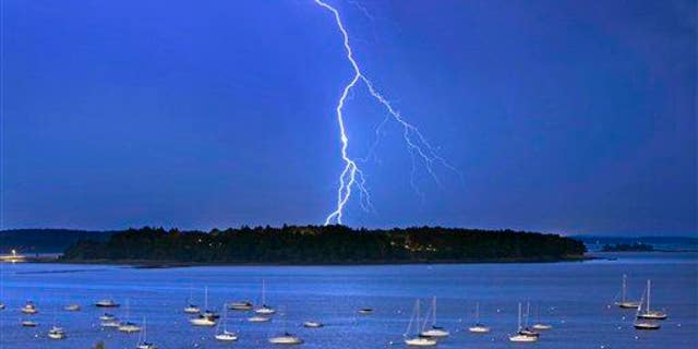 In this Sept. 11, 2013, file photo, lightning strikes north of Mackworth Island in Maine.