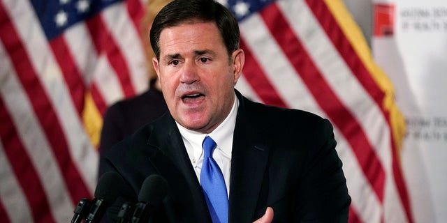 In this Dec. 2, 2020, file photo, Arizona Republican Gov. Doug Ducey answers a question during a news conference in Phoenix. (AP Photo/Ross D. Franklin, Pool)