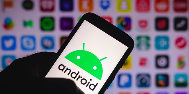 In this photo illustration an Android logo seen displayed on a smartphone. 