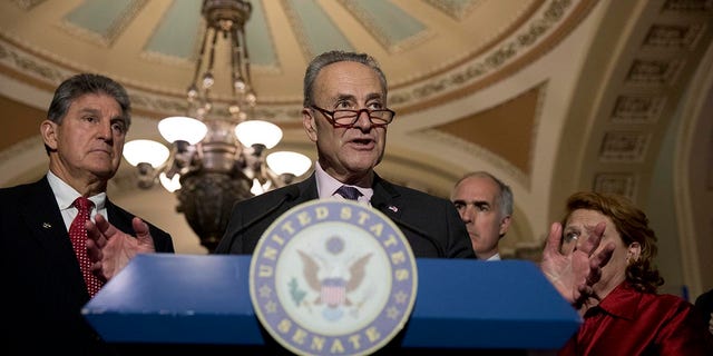Senate Minority Leader Chuck Schumer, flanked by Sen. Joe Manchin (D-WV), Sen. Bob Casey (D-PA) and Sen. Heidi Heitkamp (D-ND), speaks to the media after the weekly policy luncheon on Capitol Hill May 2, 2017 in Washington, D.C. 