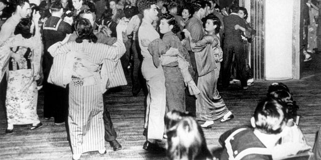 U.S. servicemen and Japanese women dancing at the Oasis nightclub, Tokyo, 1945. Joel Pritchard, Washington state politician and creator of pickleball, served in the U.S. Army occupation force in Tokyo after World War II. 