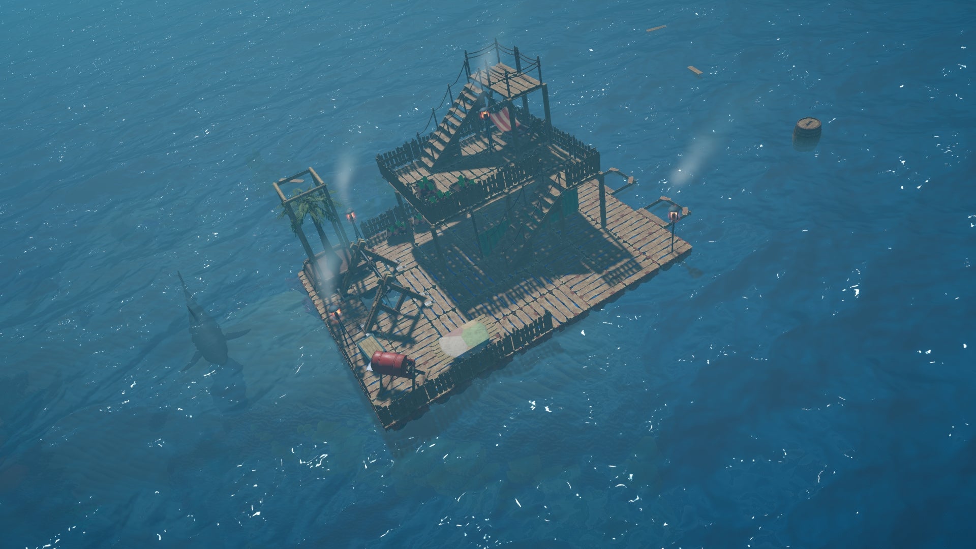 An enhanced raft can be seen floating in the ocean with a shark and a barrel beside it in Raft.