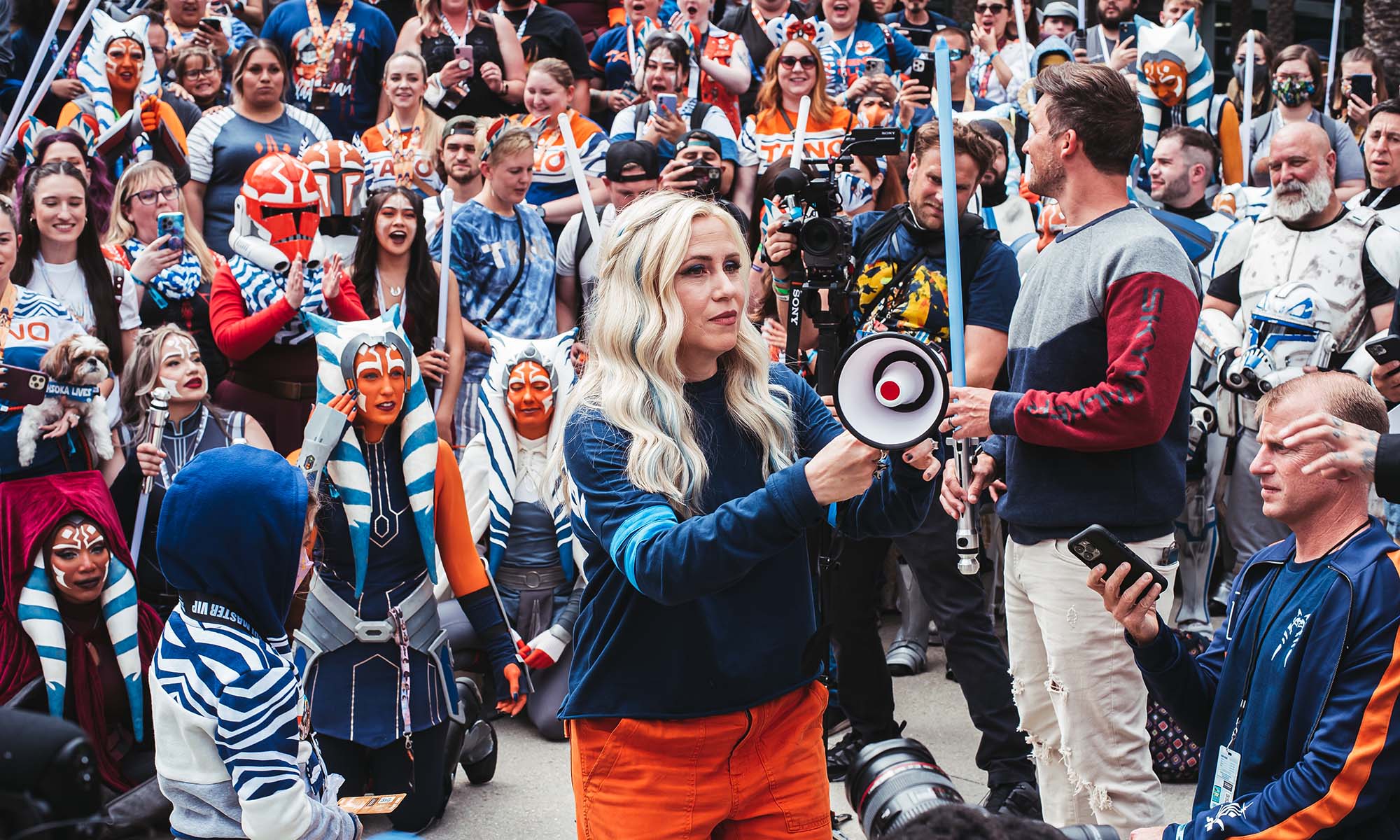 Ashley Eckstein standing in front of a group of Ahsoka Tano cosplayers