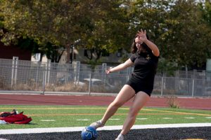 Soccer player Rocio Lybarger-Yanis practices on an empty field. 