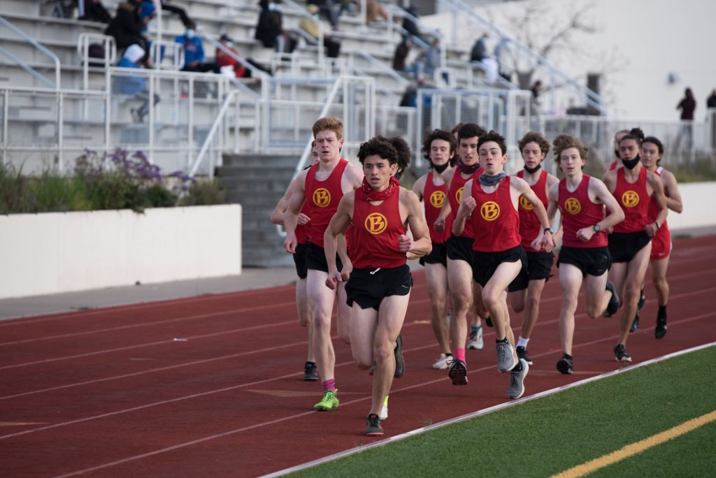 Led by Tali Bojdak-Yates, a group of BHS track and cross country athletes run in the 1600 meter race. To prevent contact between competing schools, the March 17 meet was adjusted so the teams ran in their own heat. 