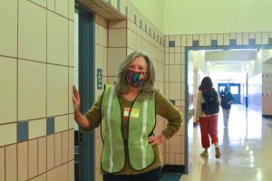 BHS parent volunteer Patricia Duignan monitors the girls bathroom in the G-Building.