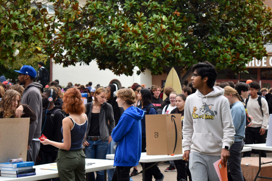 Club leaders set up stands to present to other students.