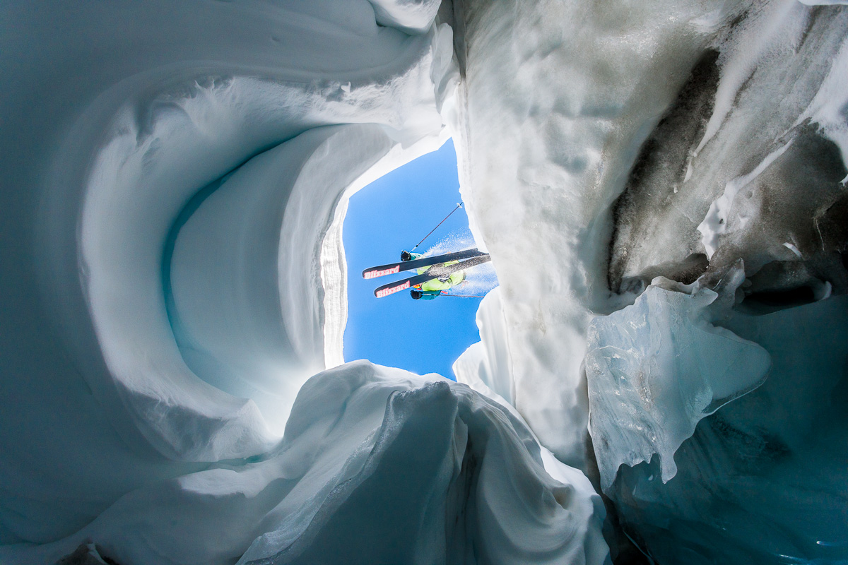 IFMGA Mountain Guide Dave Searle jumps over crevasse in La Grave