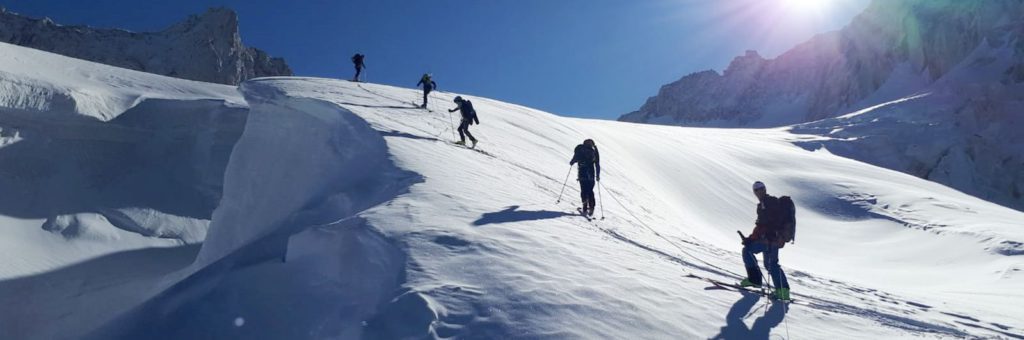 Evolution2 guests ski touring through Chamonix