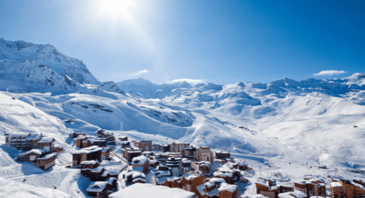 A panoramic view of Val Thorens, the highest resort in the Alps, showcasing majestic snow-covered peaks, ski slopes, and vibrant alpine architecture. Skiers carve through the pristine snow, surrounded by the breathtaking beauty of the Three Valleys. This image captures the essence of Val Thorens as a premier winter destination, inviting adventure enthusiasts to explore its high-altitude terrain and lively après-ski scene.