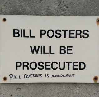 Sign affixed to wall: BILL POSTERS WILL BE PROSECUTED. Graffito beneath it: BILL POSTERS IS INNOCENT