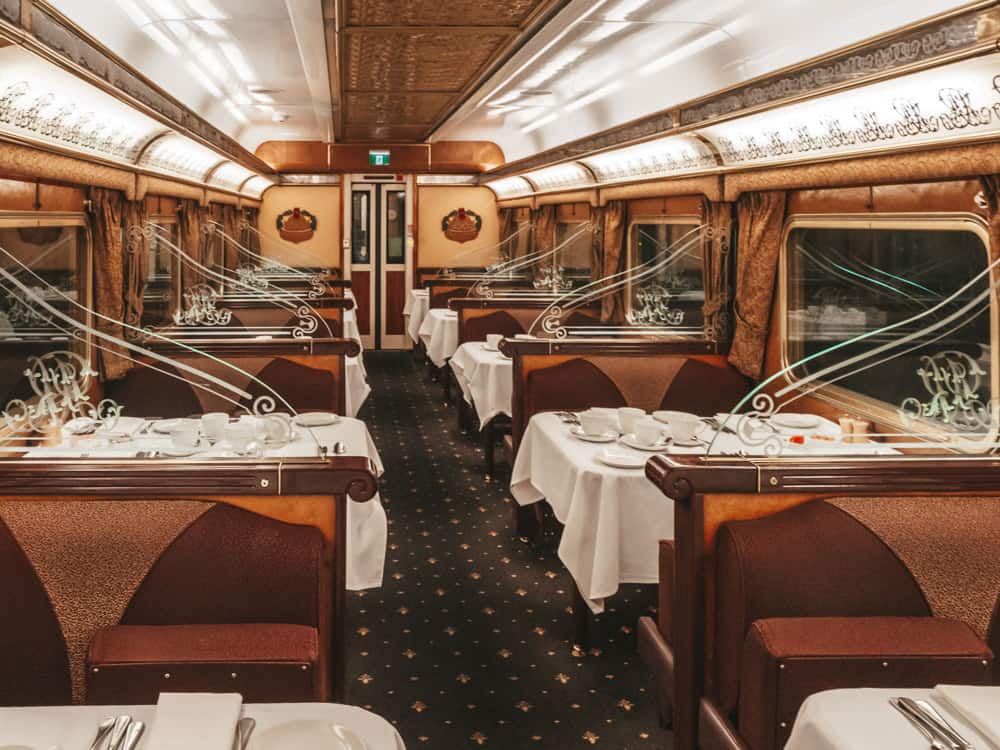The interior of the Ghan trains Queen Adelaide Restaurant set up for dinner