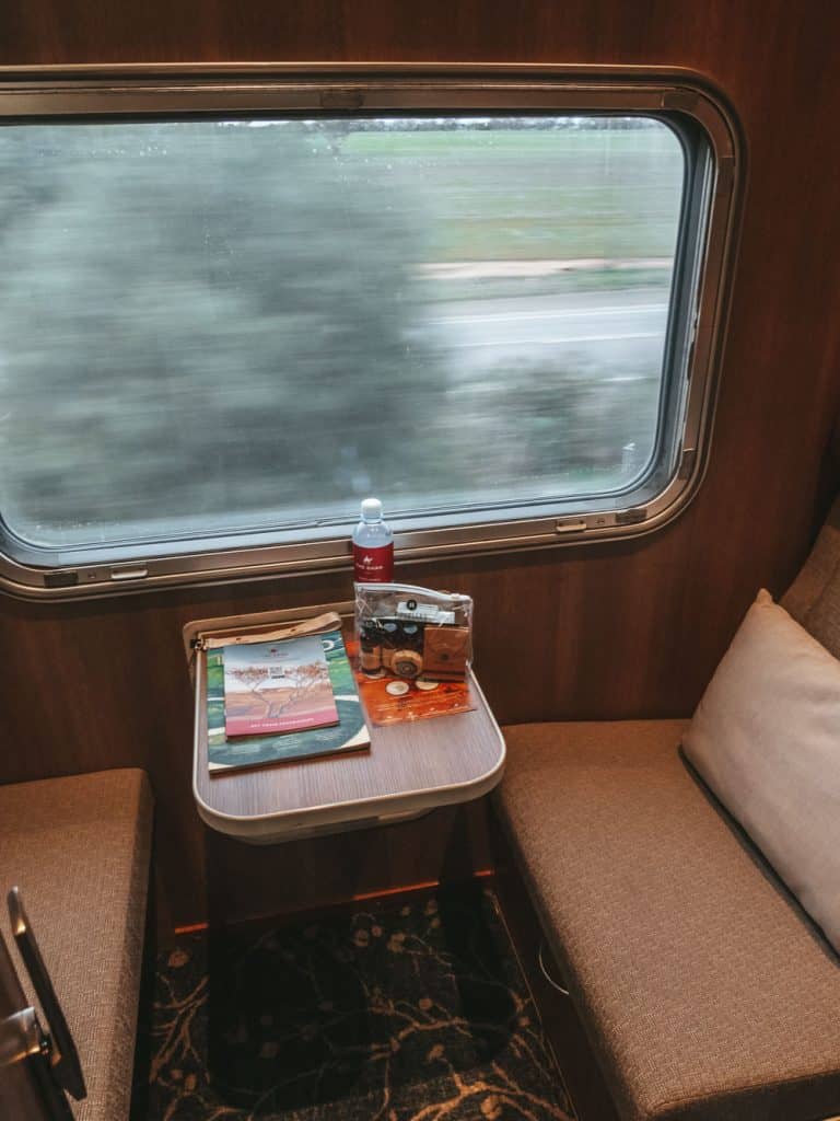 interior view of The Ghan Gold Single cabin with bush views out the window