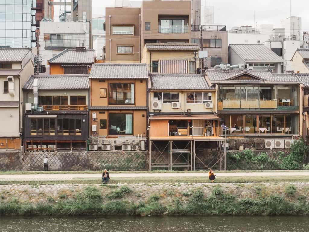 Views of Kyoto shophouses and restaurants from across the Kamo River