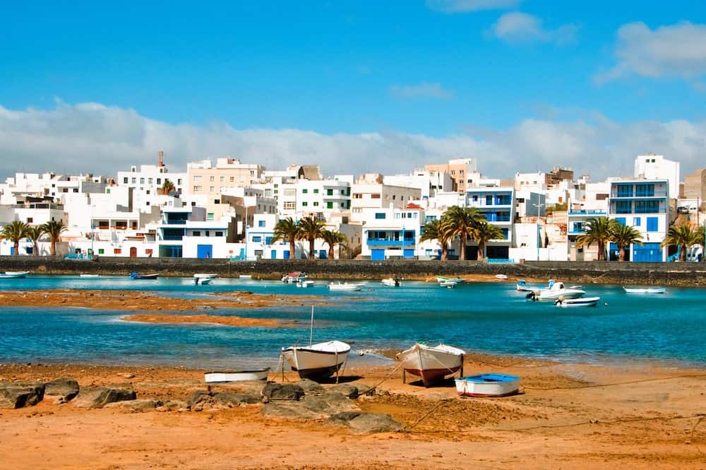 Boats and white washed buildings in Arrecife, Lanzarote, Canary Islands, Spain