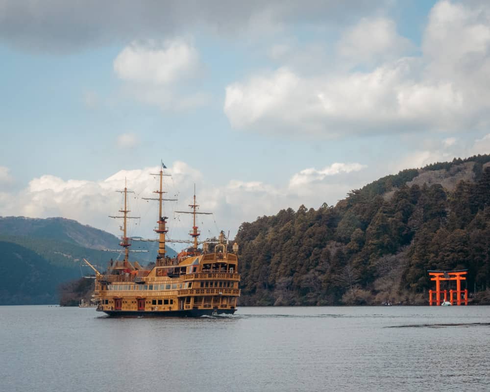 Pirate Ship and orange Torii Gate on Lake Ashi in Hakone, one of the easiest places to visit from Tokyo in Japan