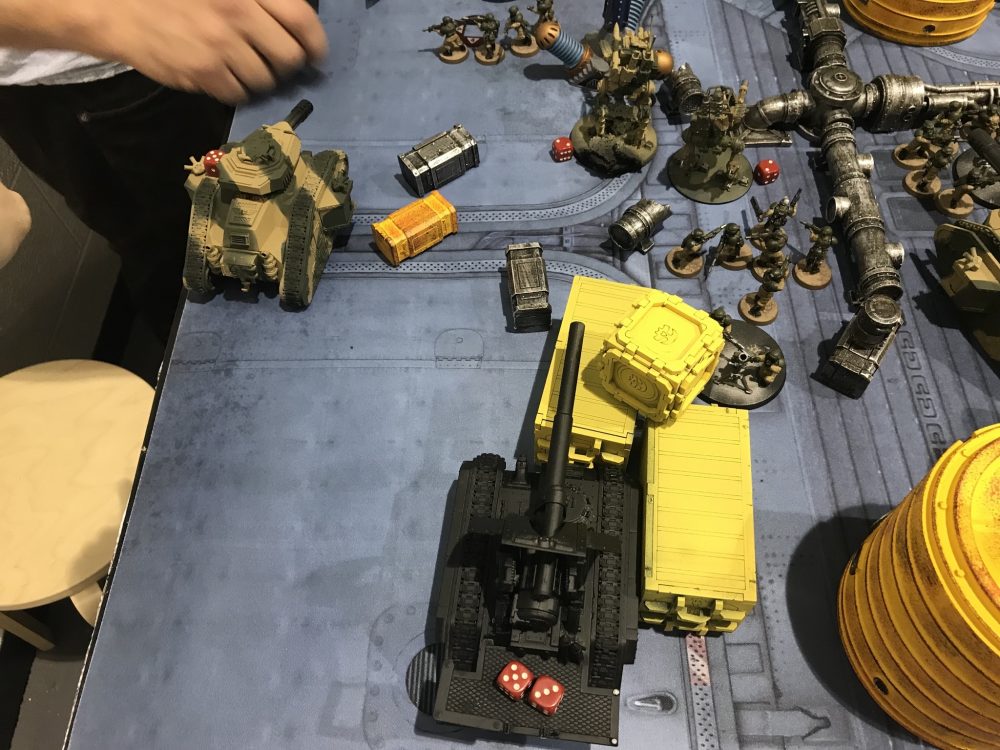 Blast from the Hemlock causing wounds on 2 Sentinels, Basilisk and a RussGuardsmen holding their objective - Aeldari vs Astra Militarum