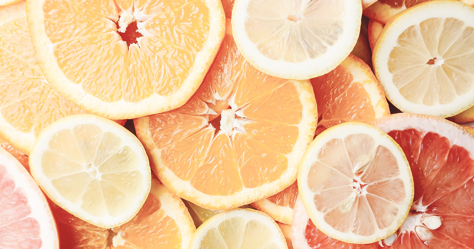 cut oranges with vitamins