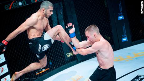 Mokaev (left) aims a knee at Jamie Kelly during Brave CF 43 in Bahrain.