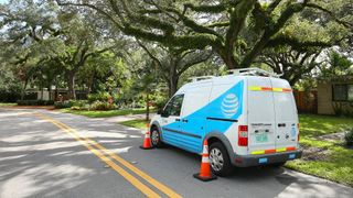 AT&T vehicle parked on a residential street as workers go in back yards to add fiber optics to utility poles in neighborhoods as seen on December 1st, 2017.