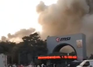 Smoke billows out of an MSI factory