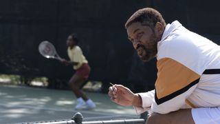 Will Smith as Richard Williams in King Richard, with Saniyya Sidney as Venus Williams in background