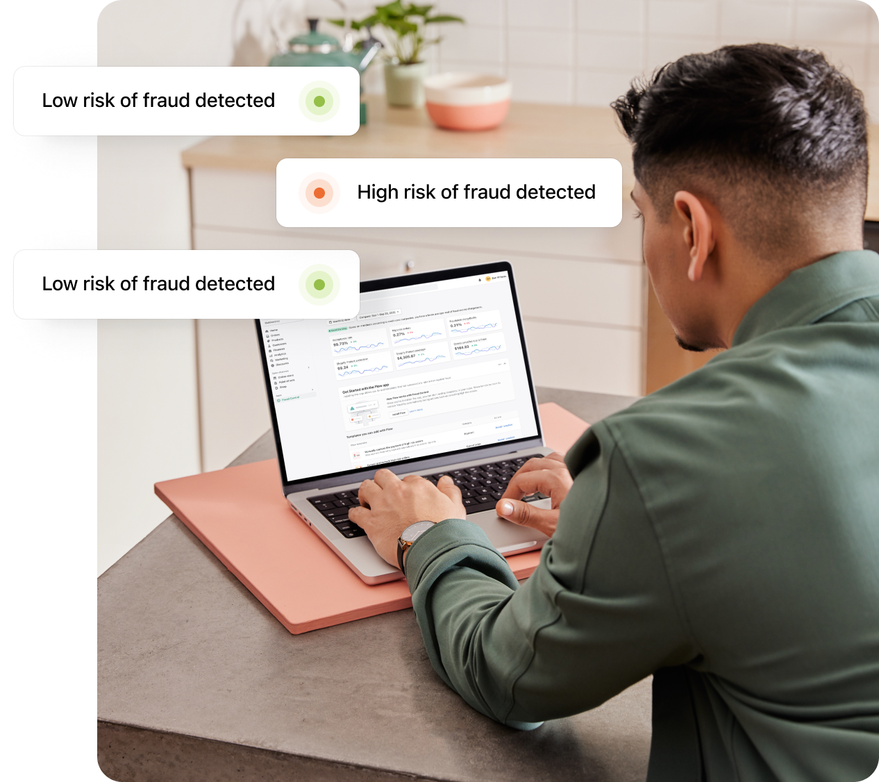 Shopify merchant sitting at a desk with a laptop and receiving notifications of low-risk and high-risk fraud.