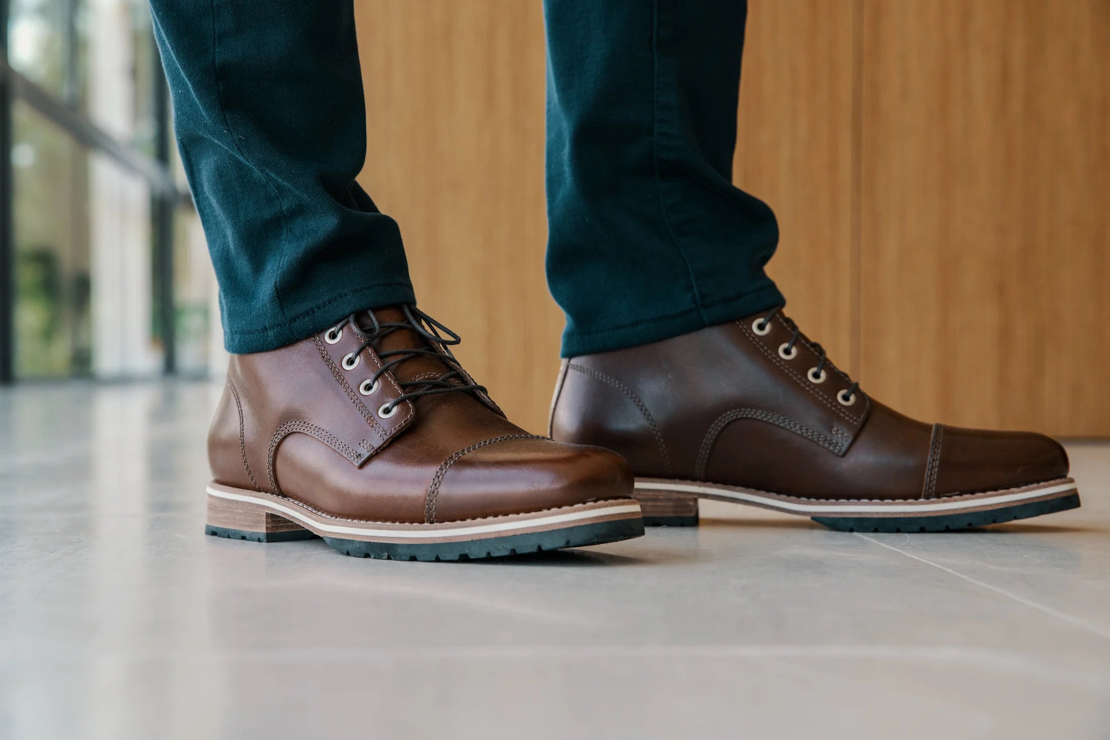 Close crop of a man's feet wearing leather boots