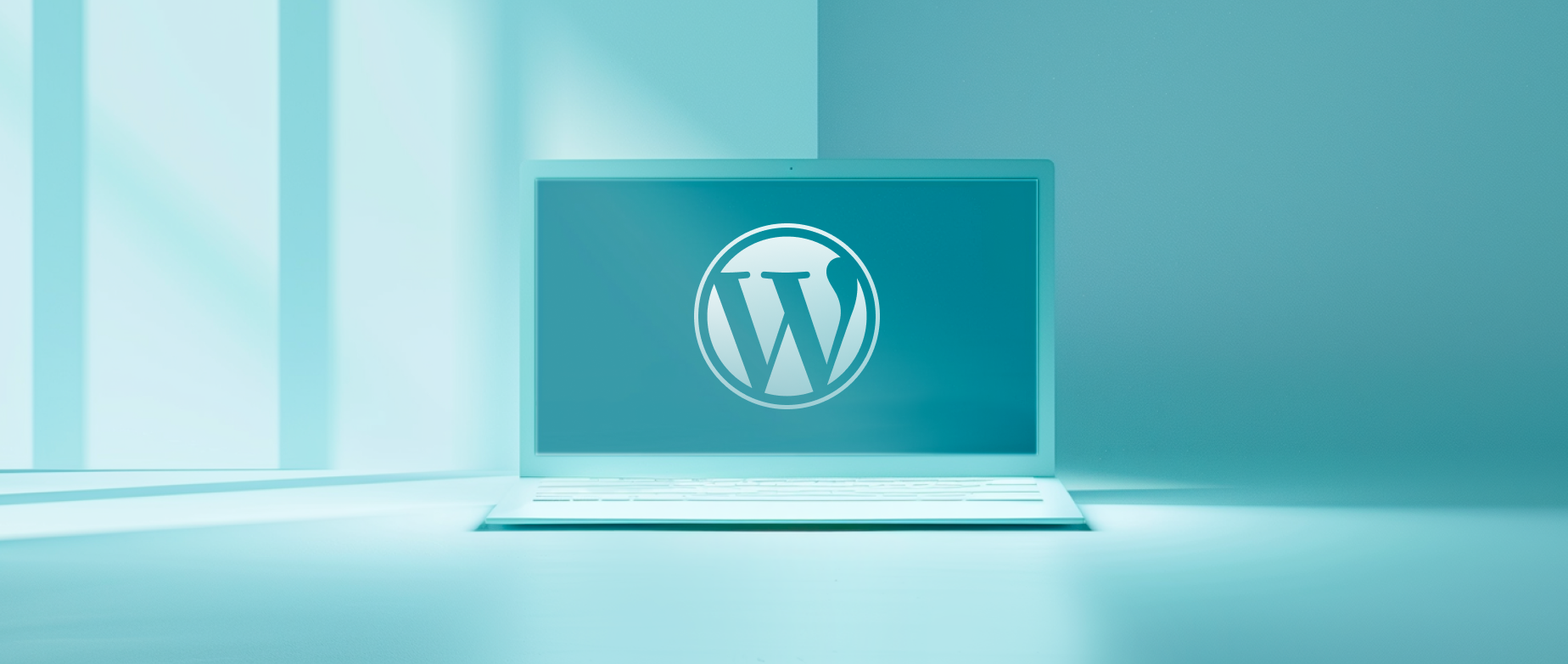 An open laptop with a WordPress logo on the screen on a blue background.