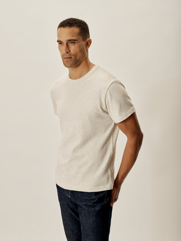 Model Wearing Heather Oat Field Spec Cotton Heavy Tee - Side