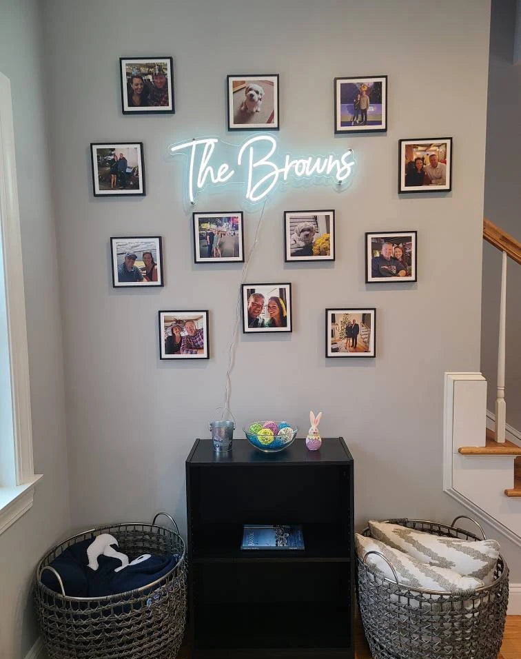 Create a custom neon name sign for your family and surround it with photos capturing happy moments. This will create a cozy and heartwarming corner in your home.