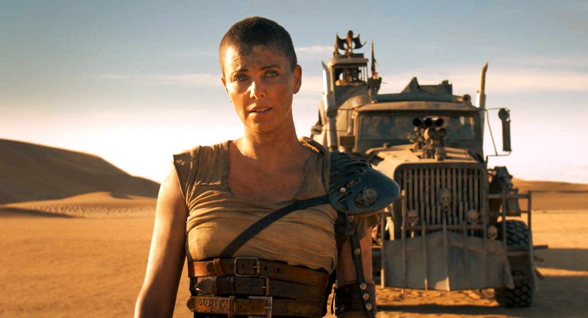 Furiosa standing in front of her truck in Mad Max: Fury Road