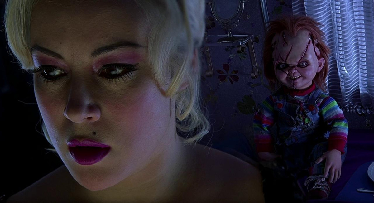 Jennifer Tilly beautifully foreground in front of Chucky in Bride of Chucky.