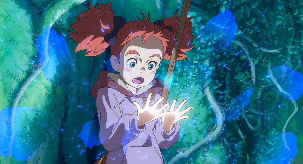 A red-haired girl in a purple hoodie gazes in astonishment at her glowing hands while holding a broomstick under her left arm and surrounded by the limbs of a gigantic tree.