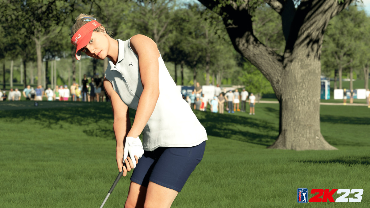 Lexi Thompson in PGA Tour 2K23, wearing a red visor and white golf glove, eyes the roll of her putt.