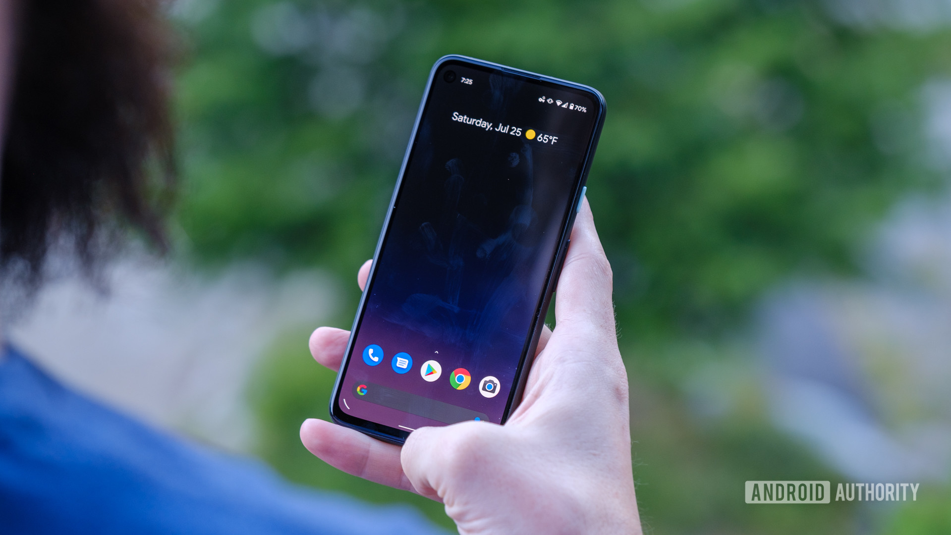 Google Pixel 4a home screen in hand 1