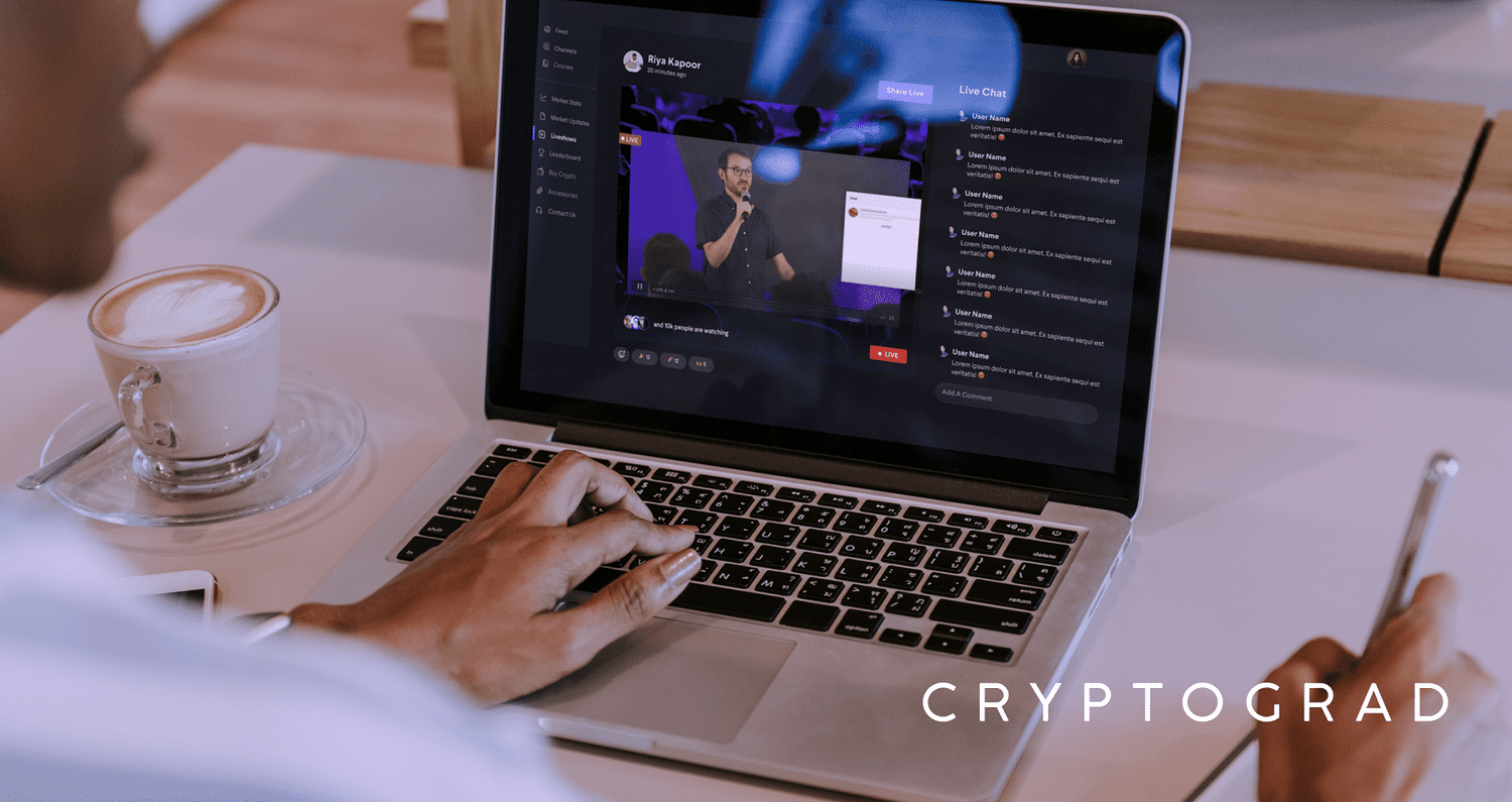 man watching educational video on laptop on cryptograd app