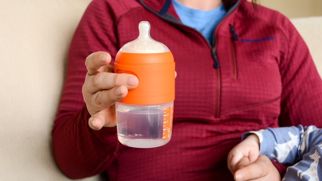 baby bottle - the buttons on either side of the popyum bottle can be squeezed with...