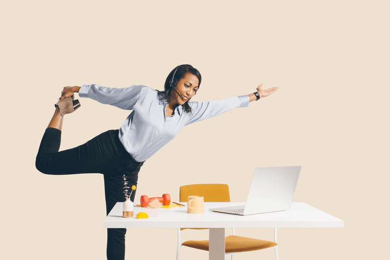 Woman stretching at her desk