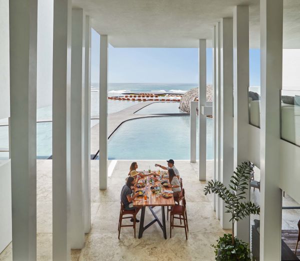 A Dining Room Table In Front Of A Window