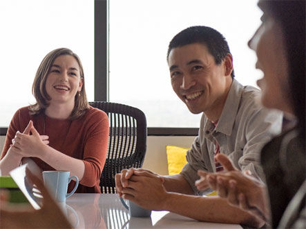 Co-workers collaborating in a room