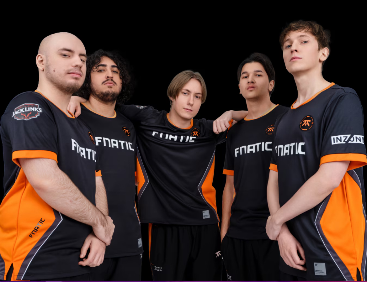 A photo of five FNATIC players in gameplay huddle on a black background.