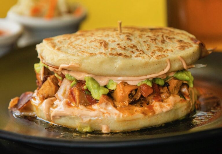 Orange Marinated Chicken Pupusa Burger with choice of two stuffed pupusa's filled with pico de gallo, guacamole, lettuce, cheese and chipotle cream from Don Julio's Latin Grill & Pupusas in Rohnert Park on Monday, August 31, 2020. (Photo by John Burgess/The Press Democrat)