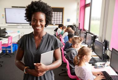 Female teacher in a computer room