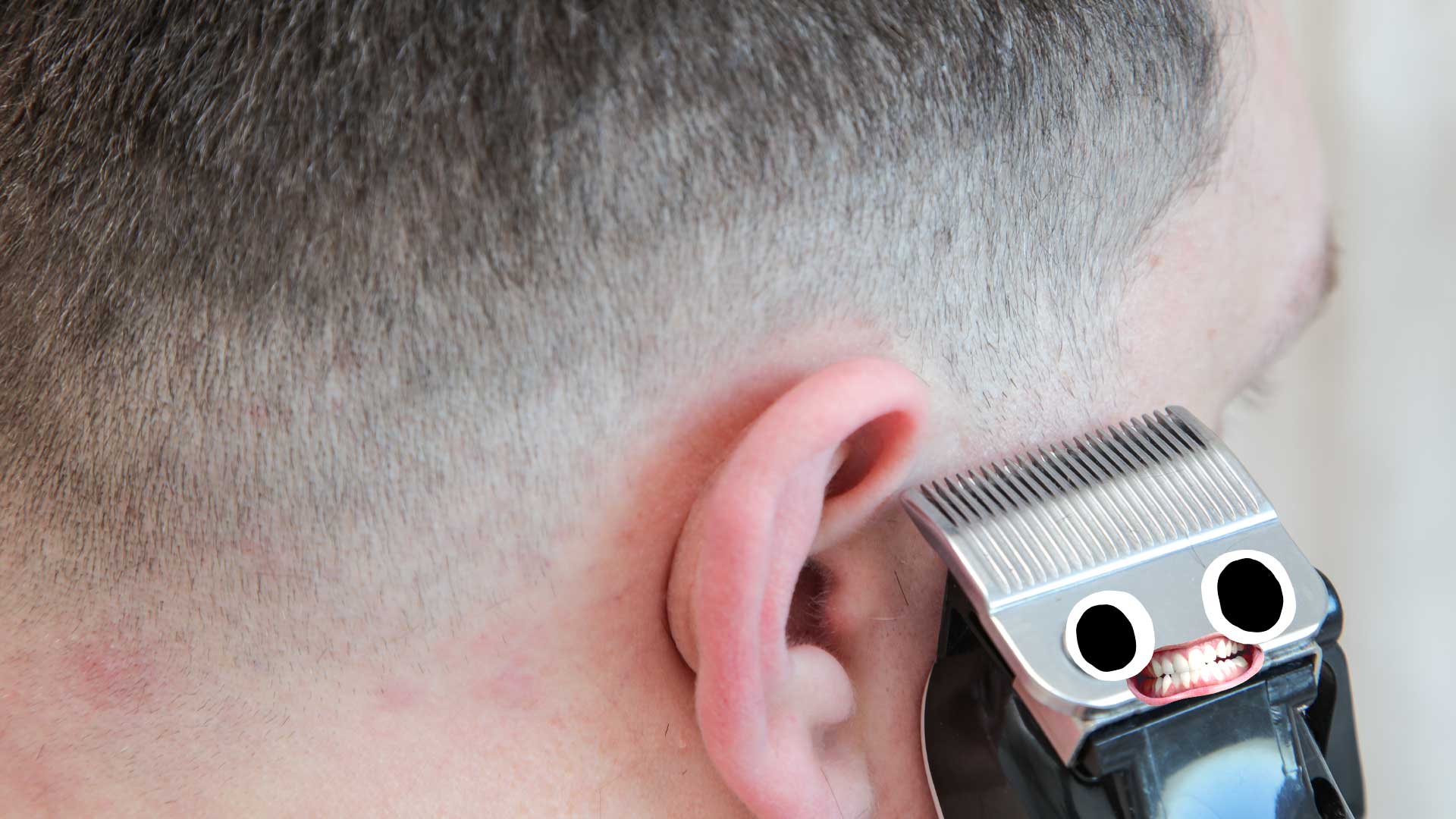 A man giving himself a haircut