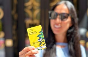 A Person Holding A Yellow Box