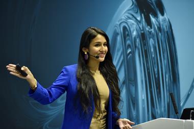 Rosa Espinoza speaking behind a lecturn at the Lab Innovations conference in 2023