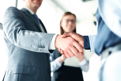 Business people shaking hands, finishing up a meeting