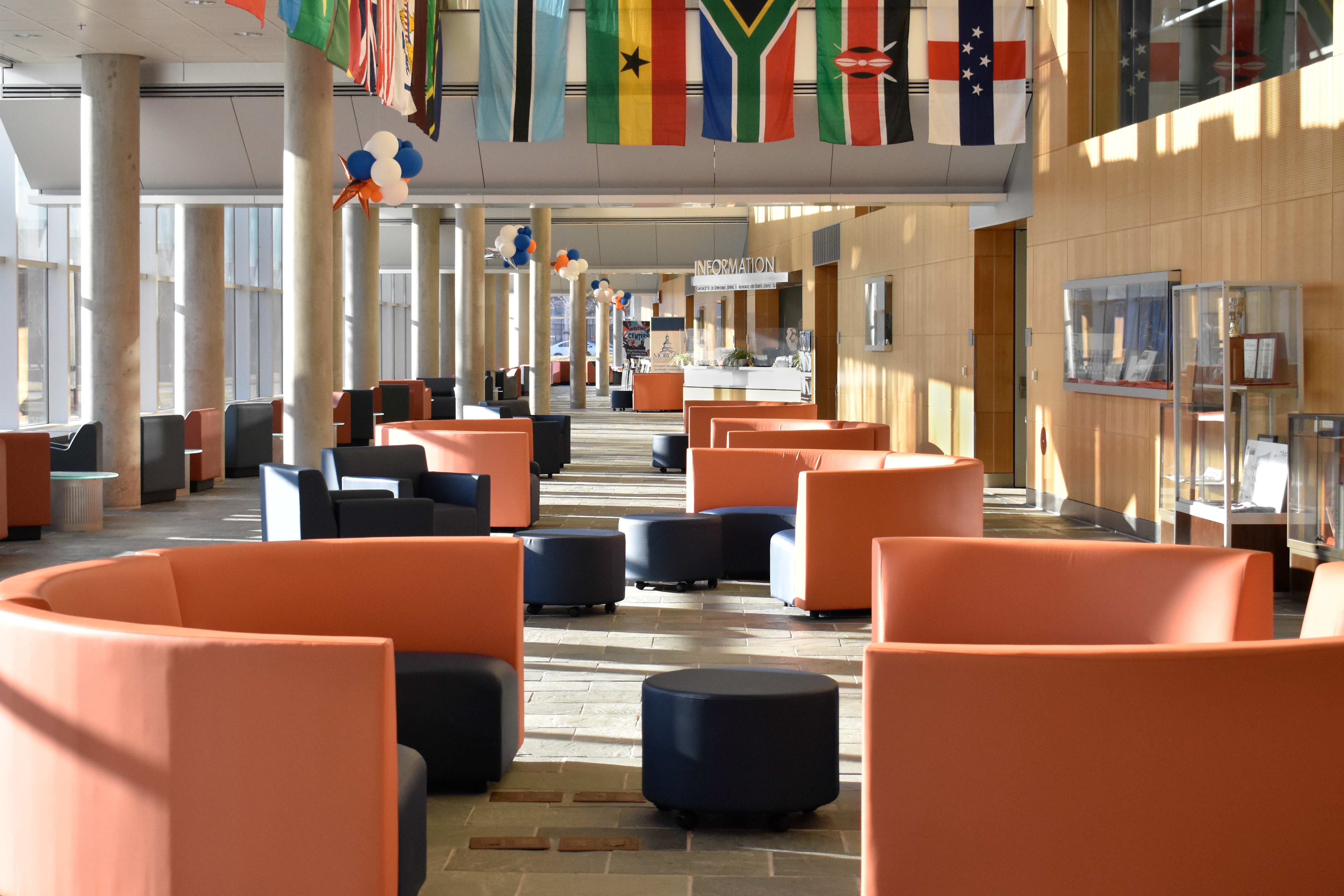 entry lobby with orange and blue upholstered furniture